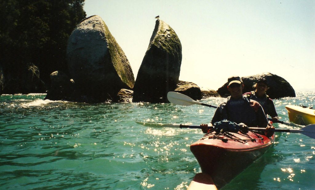 Split rock. J.F.Penn kayaking at the Abel Tasman national park, New Zealand