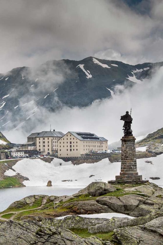 Pass summit with statue of St Bernard & Pilgrim hostel. Photo copyright Derry Brabbs. Used with permission.