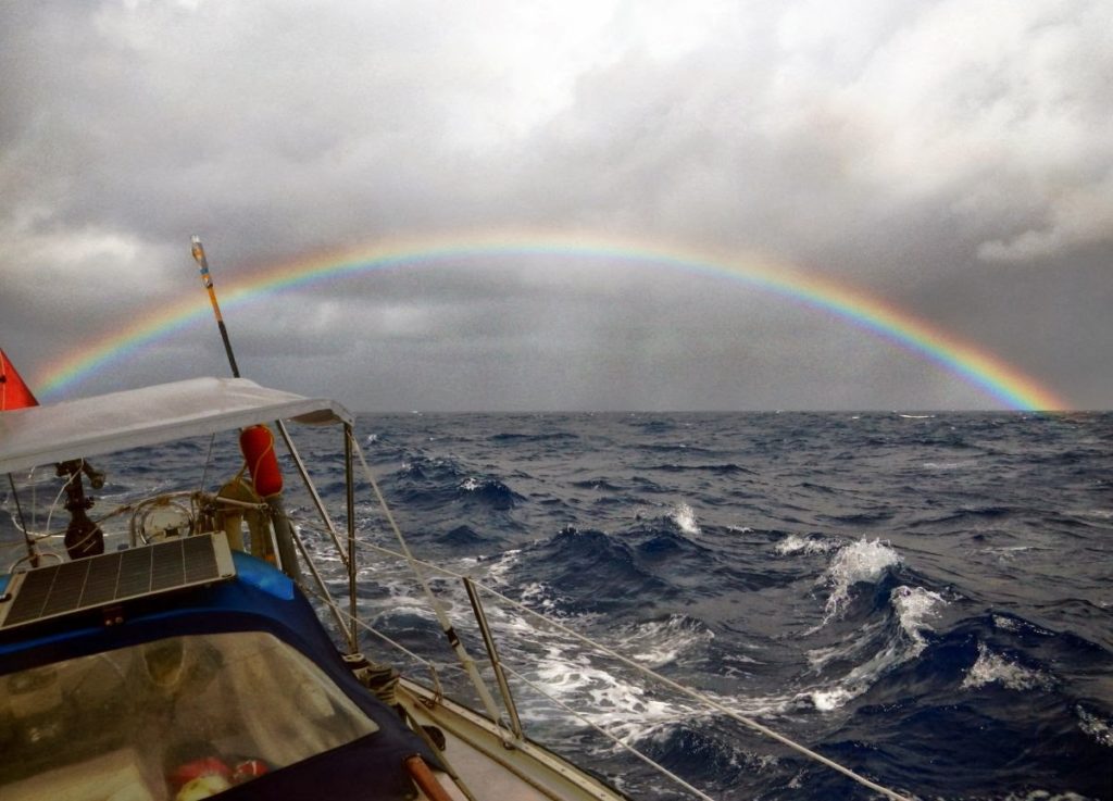 Rainbow behind Namani, Sailing Fiji to Vanuatu. Photo by Nadine Slavinski