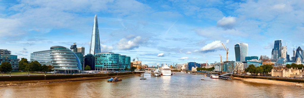 London, South Bank Of The Thames on a bright day. Panoramic image taken from the Tower bridge. Photo licensed from BigStockPhoto