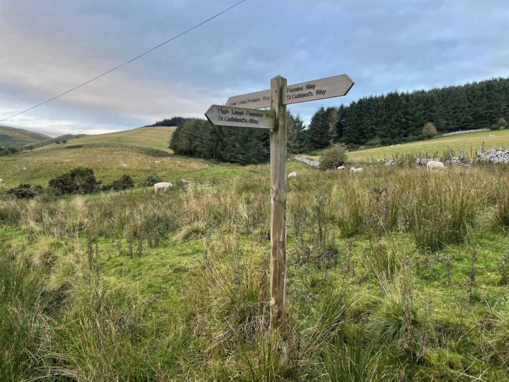 Crossroads of Pennine Way and St Cuthbert's Way at Kirk Yetholm Photo by JFPenn