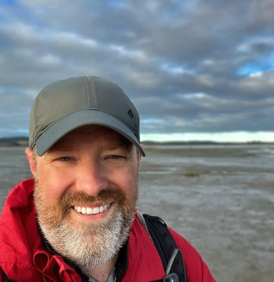 Pilgrim Kevin Donahue about to cross the sands to Lindisfarne Holy Island Photo by Kevin Donahue