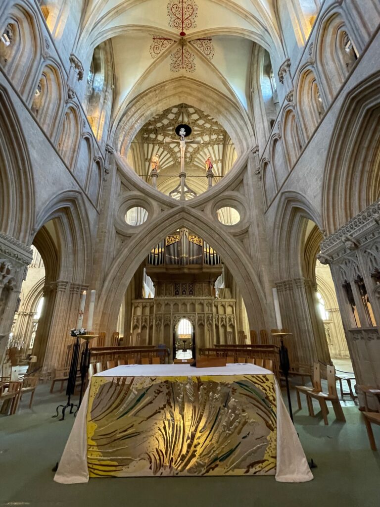 Scissor arch behind altar, Wells Cathedral Photo by JFPenn