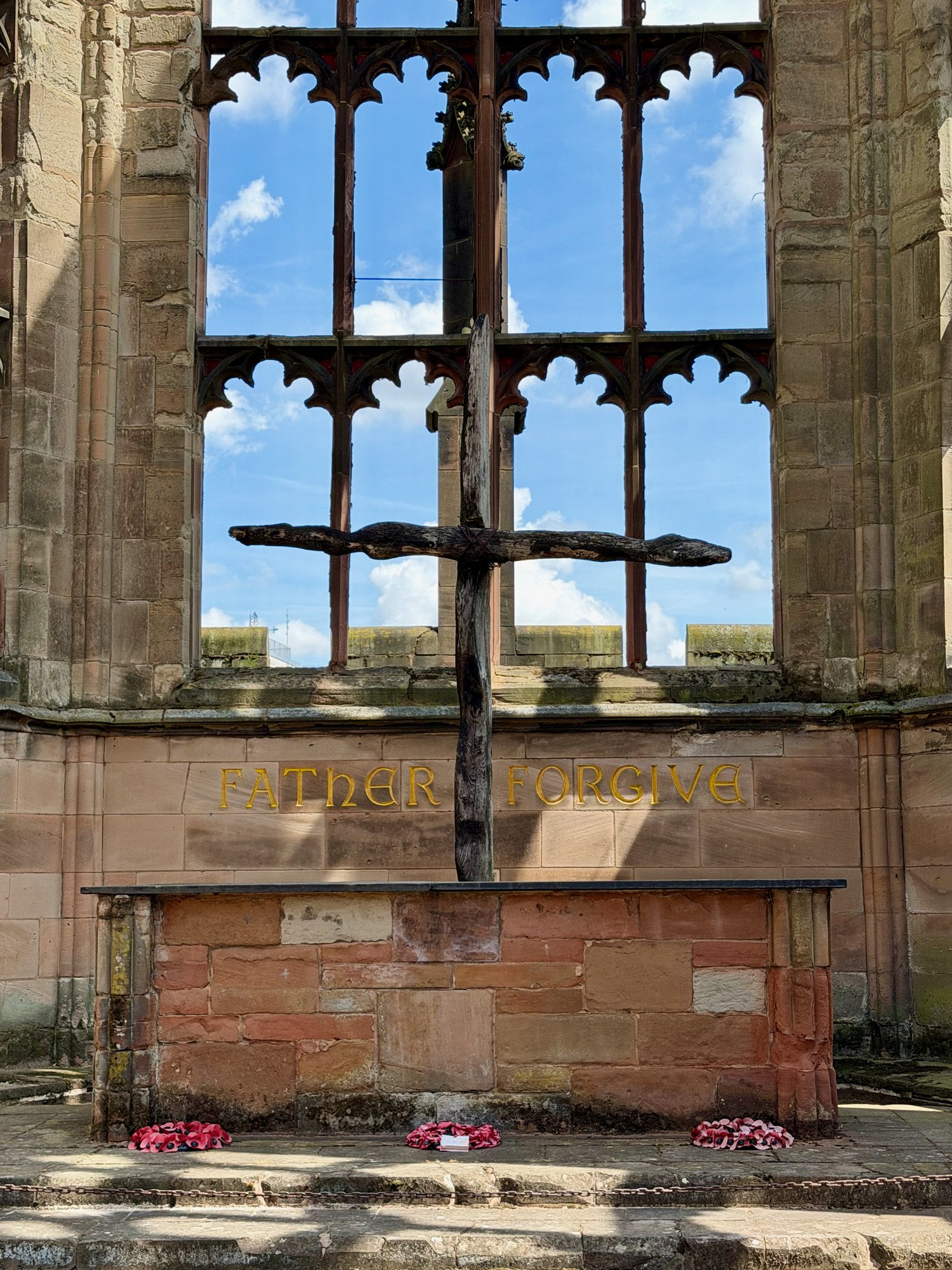 Charred Cross and the Father Forgive inscription, Coventry Cathedral ruins. Photo by JFPenn
