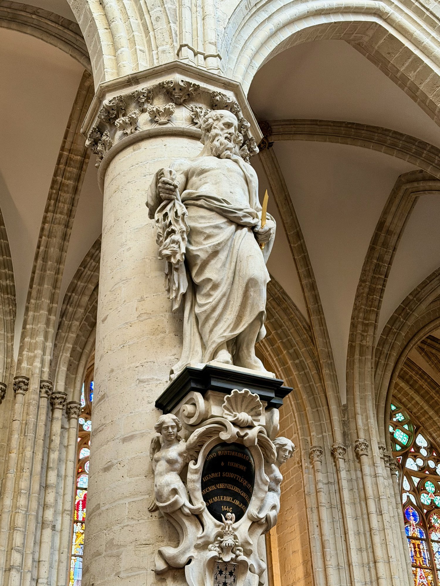 St Bartholomew holding his flayed skin, Cathedral of St Michael and St Gudula, Brussels. Photo by JFPenn