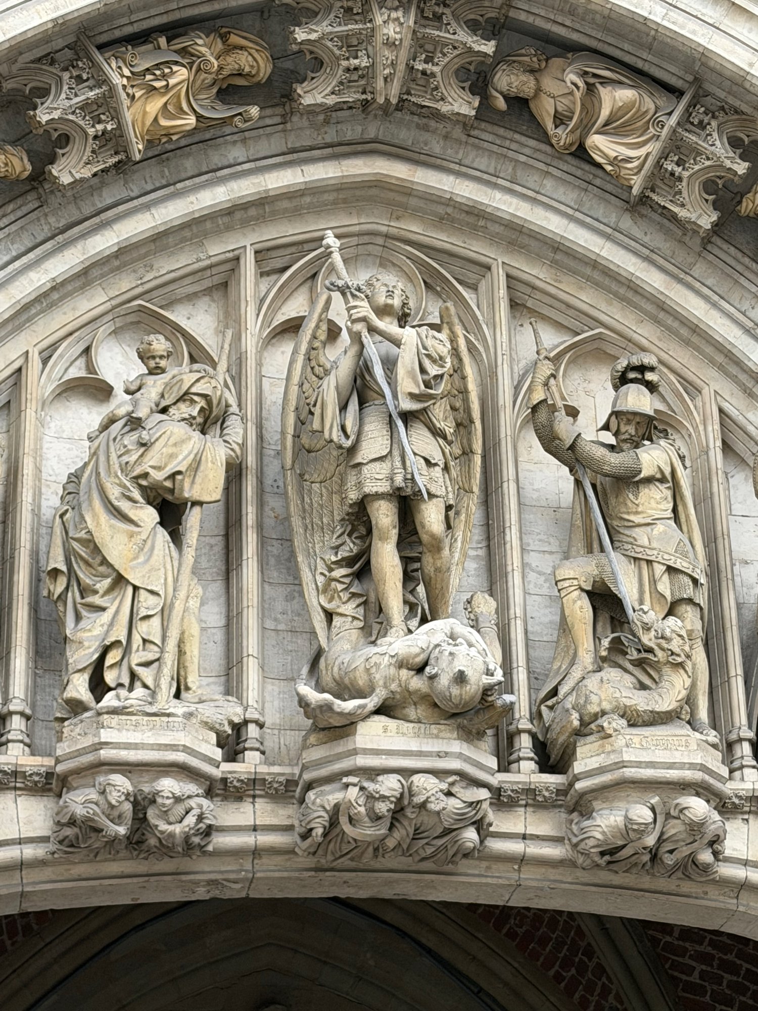 St Michael slaying the demon on the Town Hall portal, Grand-Place, Brussels. Photo by JFPenn