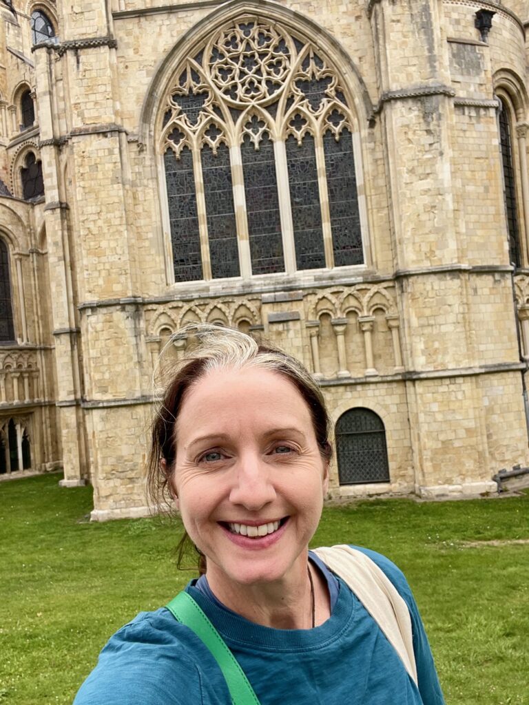 Jo Frances Penn below the St Anselm's Chapel window, Canterbury Cathedral. Photo by JFPenn
