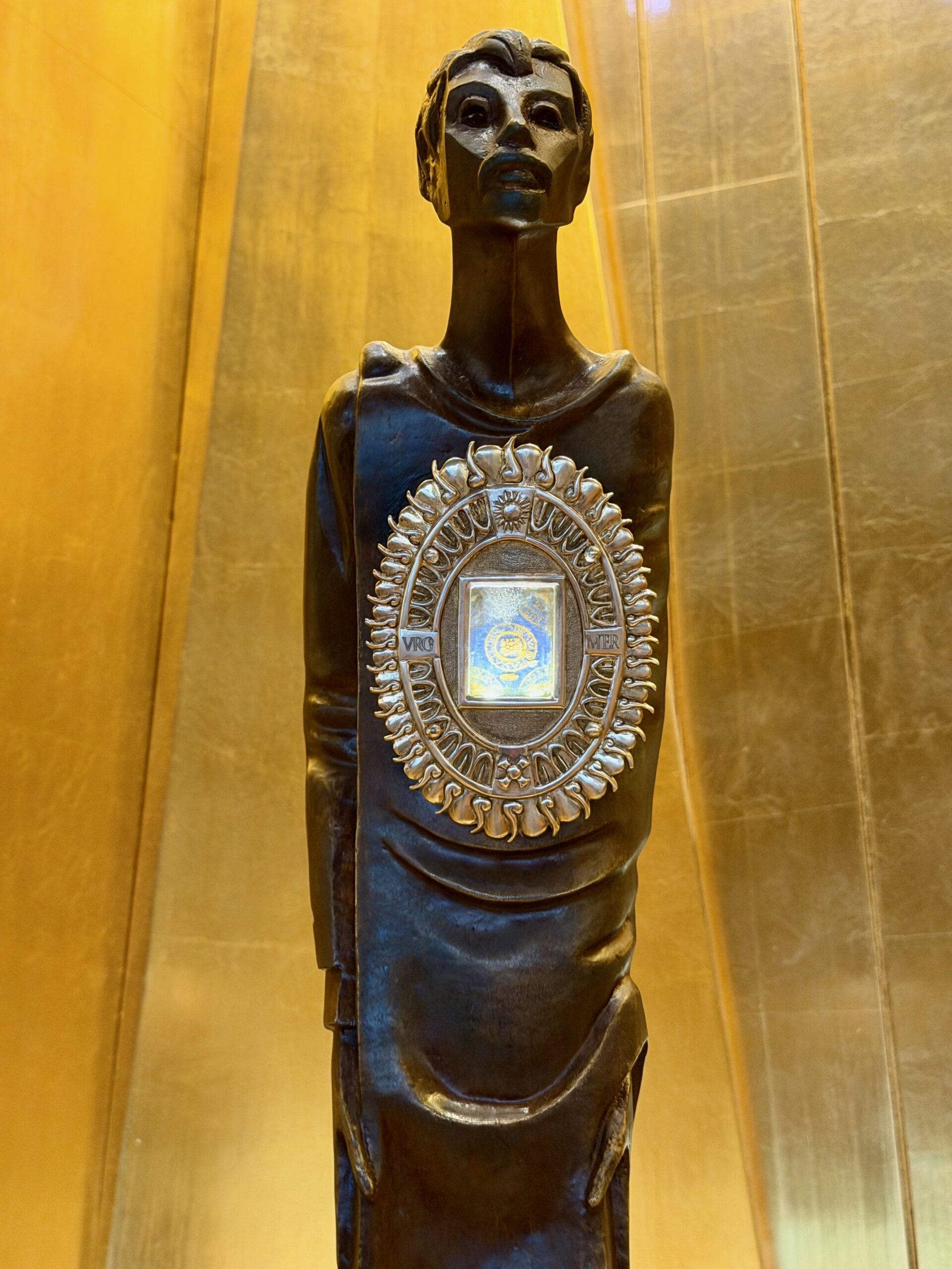 Bronze statue of St Juan Diego holding the reliquary, Cathedral of Our Lady of the Angels. Photo by JFPenn